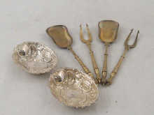Two pairs of silver gilt pickle