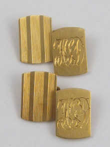 A pair of yellow metal tests 18 15013a