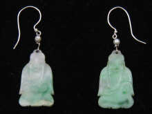 A pair of jade earrings the jade