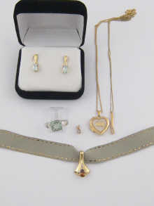 Three 9 ct gold pendants one locket