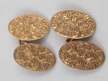 A pair of 9 ct gold cufflinks with chased