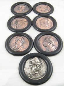 Seven ebony mounted copper plaques 1501dc