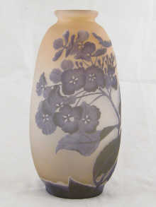 An art glass vase with floral overlay