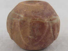 An ancient mace head carved with