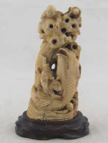 A well carved Oriental ivory group of