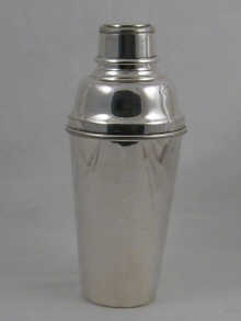A silver plated cocktail shaker
