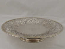 A pierced silver dish on stand