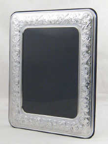 A silver photograph frame measuring