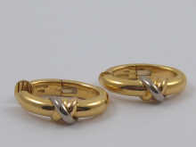 Cartier; a pair of 18 carat gold