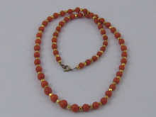 A coral necklace set with alternate