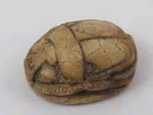 A carved scarab probably ancient approx.