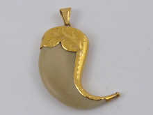 A tiger s claw pendant with engraved 150262