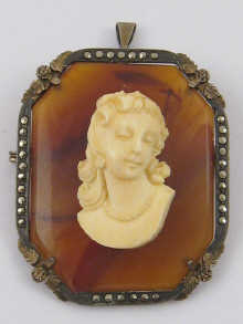 An ivory cameo mounted on agate set