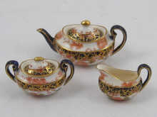 A Royal Crown Derby miniature china