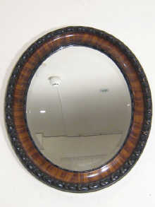 An oval bevelled mirror the wooden 1502ef