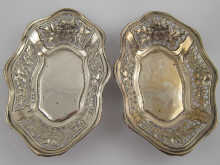 A pair of silver bon bon dishes