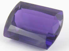 A loose polished amethyst measuring 15034f