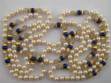 A pearl necklace set with lapis 15035c