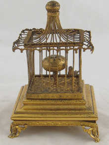 A brass table clock in the form
