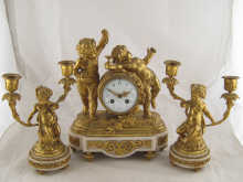 A gilt bronze clock garniture on