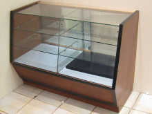 A glass fronted display cabinet 123