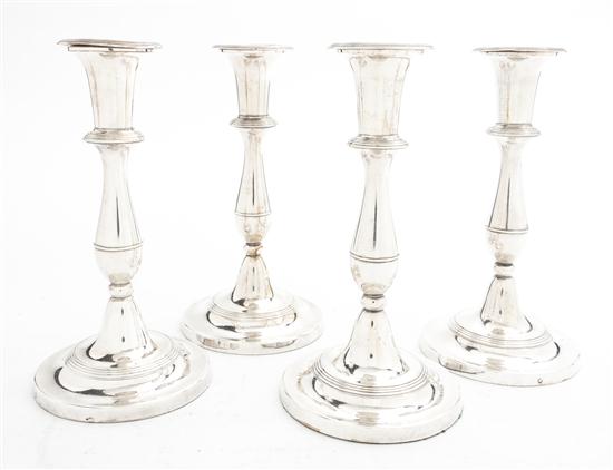 A Set of Four Sheffield Plate Candlesticks