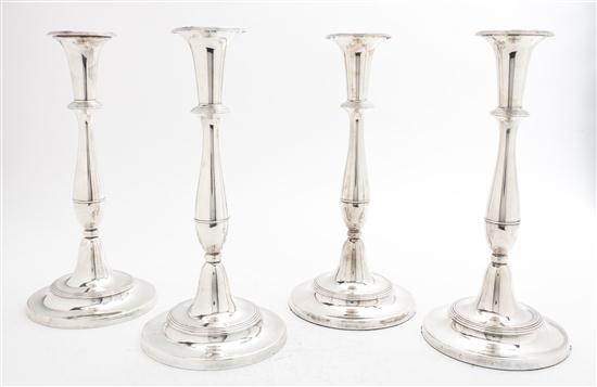 A Set of Four Sheffield Plate Candlesticks