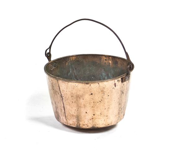 A Copper Kettle of handled circular