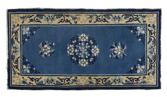 A Chinese Wool Rug having a central 150854