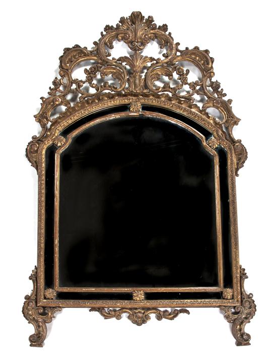 *A Baroque Style Giltwood Mirror