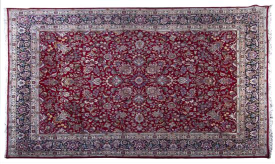 A Persian Wool Rug having a foliate 150d29