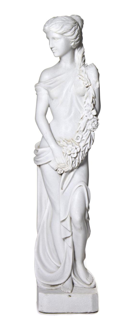 A Carved Marble Figure depicting
