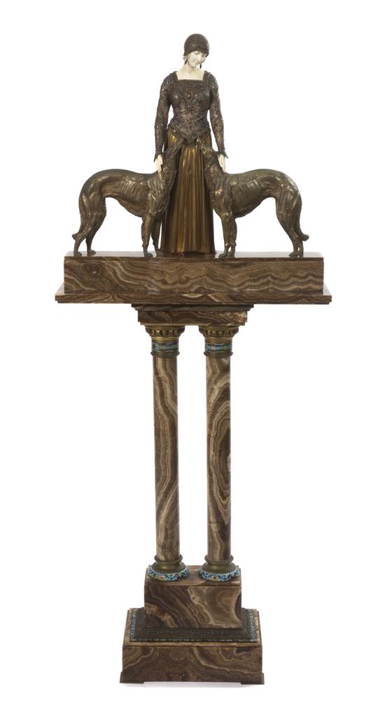 *A French Bronze and Ivory Figural Group