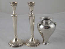 A silver vase ht. 9.5cm and a pair