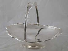 A swing handled cake basket with shaped