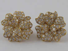 A fine pair of diamond and gold ear