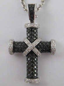 An 18 carat white gold cross pave