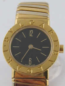 A two colour 18 carat gold bangle watch