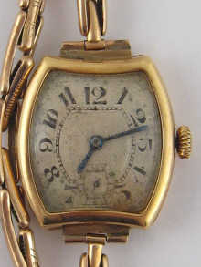 An 18 carat gold wrist watch by