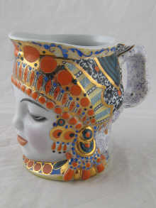 A Russian ceramic tankard formed and