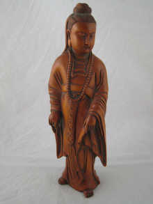 A Chinese carved boxwood figure