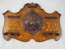 A well carved oak pipe rack with 14e8cf