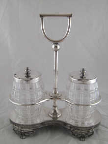 A plated two jar stand with cut glass