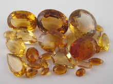 A quantity of loose polished citrines