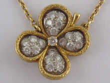 An 18 carat gold diamond set pendant