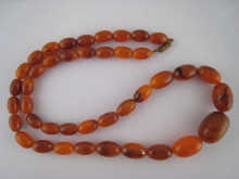 An amber necklace largest bead
