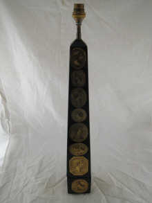 A black obelisk table lamp with 14e989