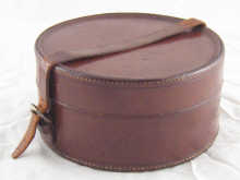 A leather collar box 18cm diameter.