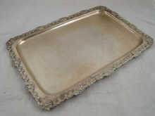A rectangular silver tray with applied