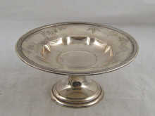 A silver cake dish by Gorham U.S.A engraved